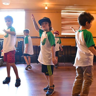 Kids sing and dance during a class at Swallow Hill Music in Denver