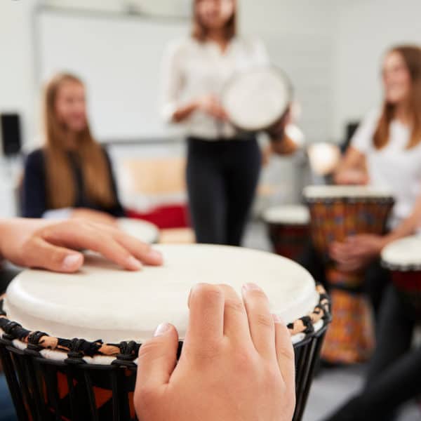 Teenage Students Studying Percussion In Music Class