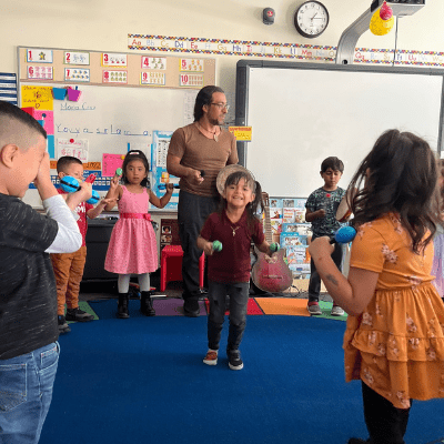 Instructor Adolfo Romero teaches a Little Swallows Early Childhood Education music class at an underresourced Denver metro area school