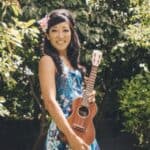 Cynthia Lin poses holding a ukulele