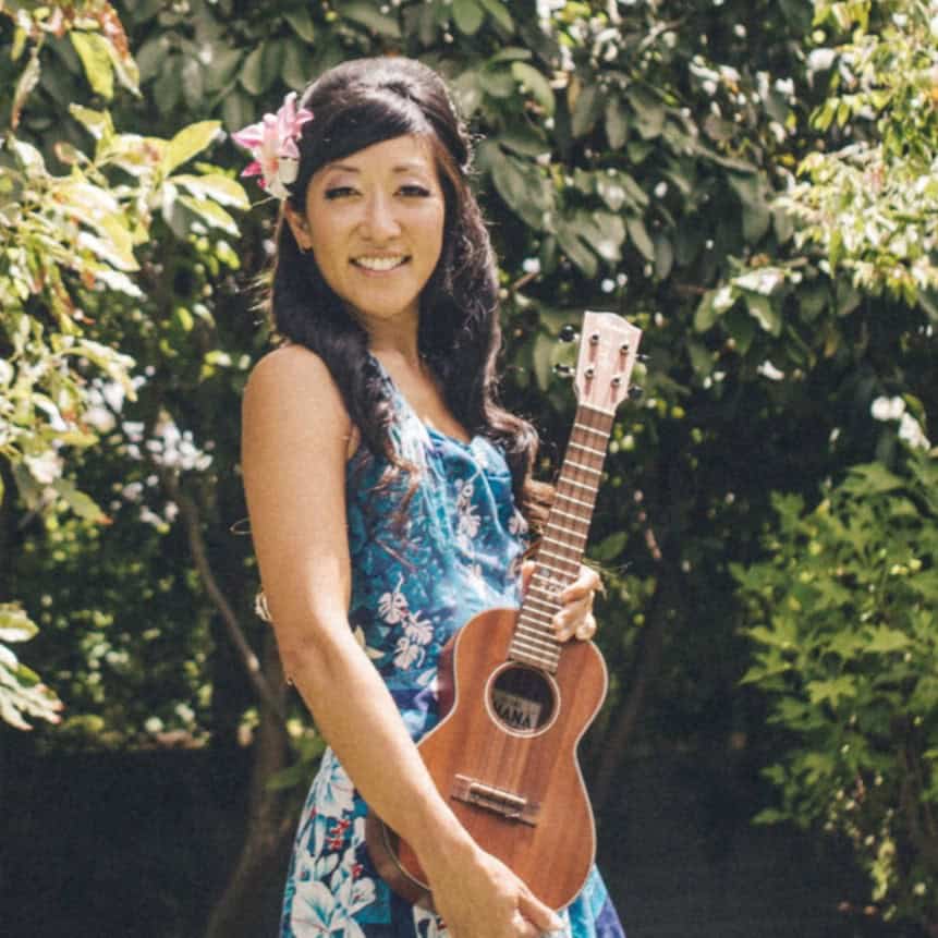 Cynthia Lin poses holding a ukulele