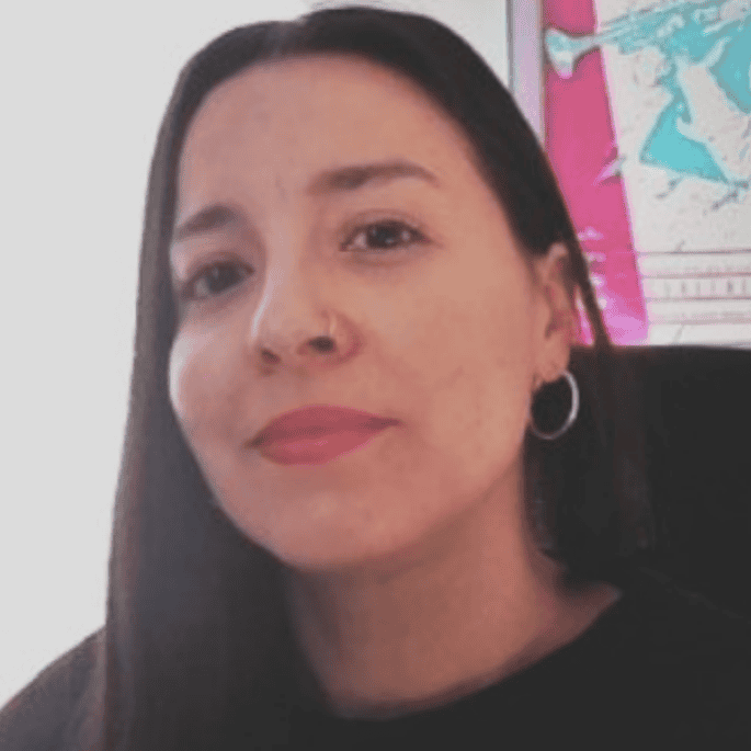 A headshot of Swallow Hill Music staff member Harry Todd, a white man with shoulder-length hair and glasses wearing a baseball cap